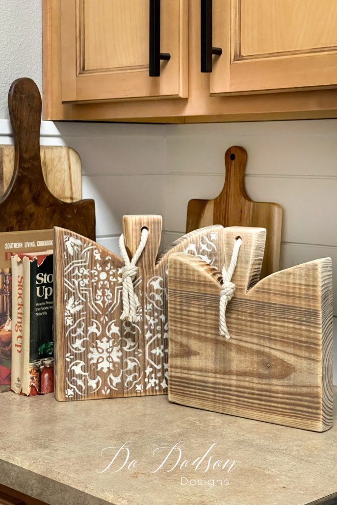 After making these DIY table risers, I decided to drill holes for hanging—another great way to display these primitive-looking cutting boards.