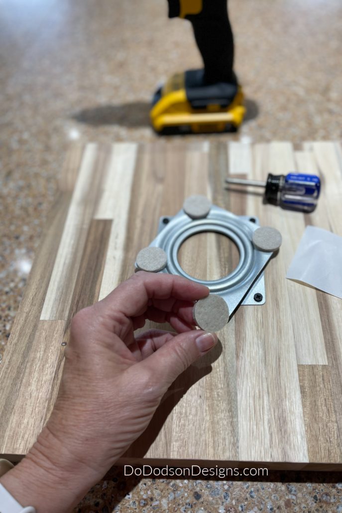 Attach felt pads to the bottom to prevent the metal from scratching your surface.