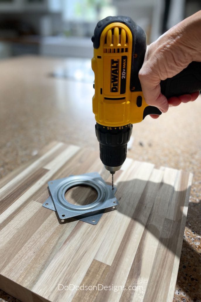 Now you're going to predrill the holes for the screws. Be sure to use a drill bit that is a bit smaller than your screw. Basically, you're making a pilot hole so that it's easier to insert the screw into the wood and it also prevents the wood from cracking if you're using older brittle wood.