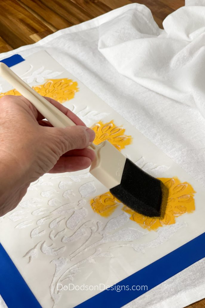 Apply the paint over the stencil using a foam brush.
