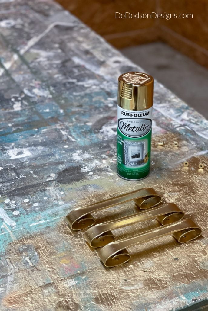 I used Rust-Oleum reflective gold spray paint to update the gorgeous curvy hardware.
