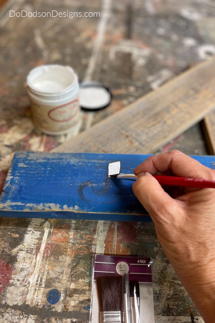Now you can paint your letters using a chisel artist brush with confidence on your 4th of July Decor Sign.