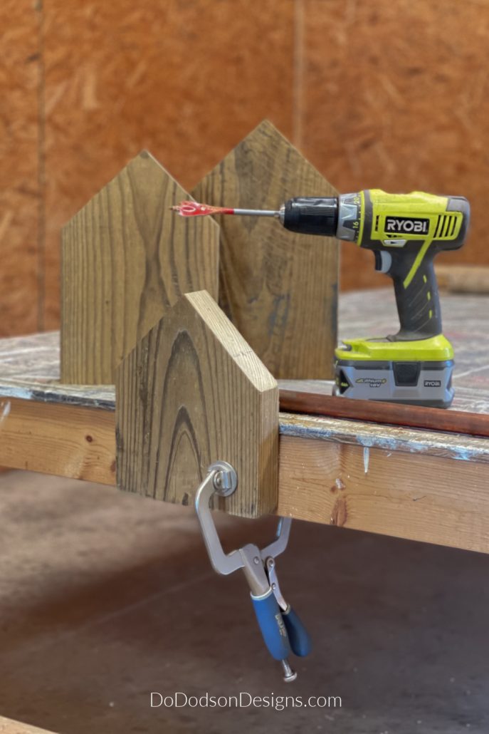 To make the scrap wood block house is fairly simple and straightforward. Cut scrap 2X10 boards into the lengths you want. Since I was doing a grouping of three wood block houses, I cut them in various lengths. One a just a bit taller than the next.