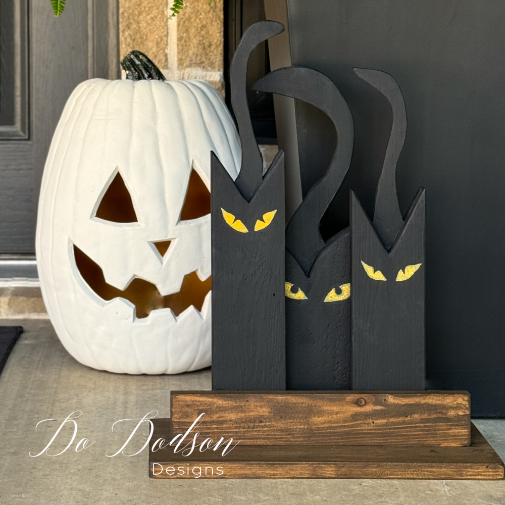 DIY Wooden Black Cat (Halloween Scrap Wood Craft) - Do Dodson Designs Create a spooky and adorable DIY wooden black cat for Halloween using scrap wood and basic crafting supplies. This simple and fun project is perfect for adding a touch of charm to your Halloween decor and can be customized with different colors and embellishments. Let your creativity run wild and make your own unique black cat to display this Halloween season!