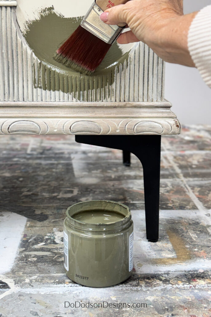 green painted cedar chest with modern black legs