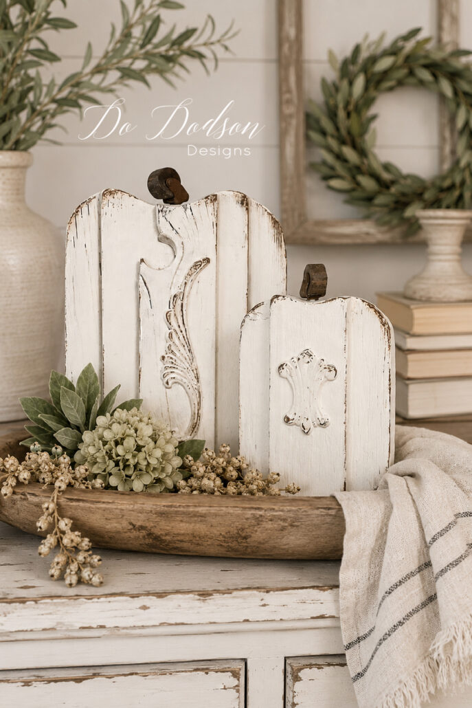 Handcrafted rustic farmhouse wood pumpkins displayed in a weathered dough bowl as cozy fall home decor.