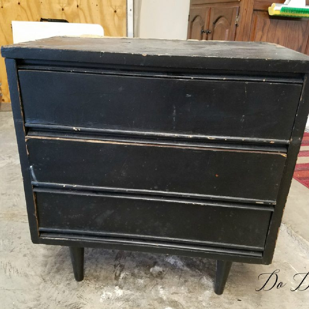 Worn black $5 Dixie nightstand with damaged veneer before its painted furniture makeover.